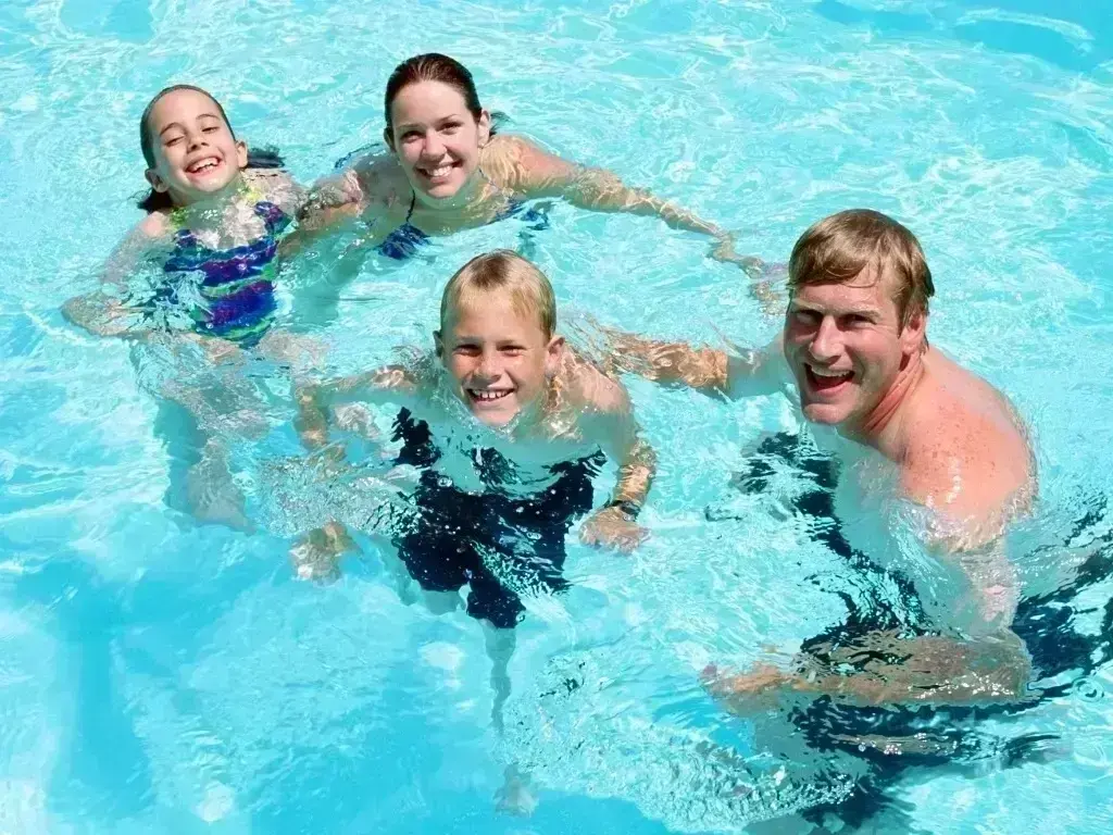 Trevi Pools and Spas service team testing pool water balance during hot Okanagan summer weather